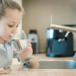 Young,Caucasian,Girl,Is,Holding,A,Glass,With,Water.,Concept