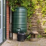 A,Green,Rain,Barrel,To,Collect,Rainwater,And,Reusing,It
